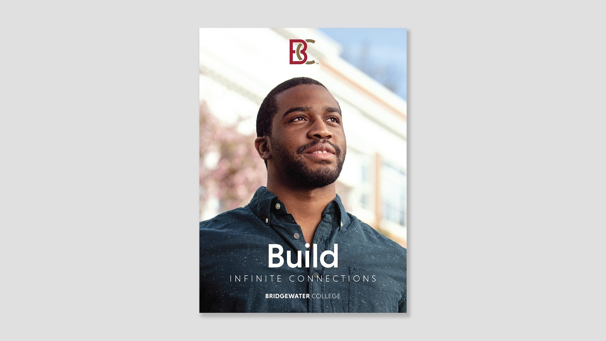 Brochure cover showing a young black man. Image text: Build infinite connections.