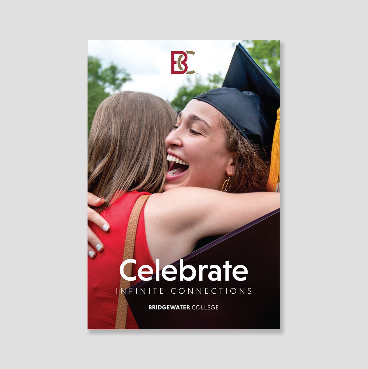 Brochure cover showing two women hugging, one wearing a graduation cap and gown. Text: Celebrate infinite connections.