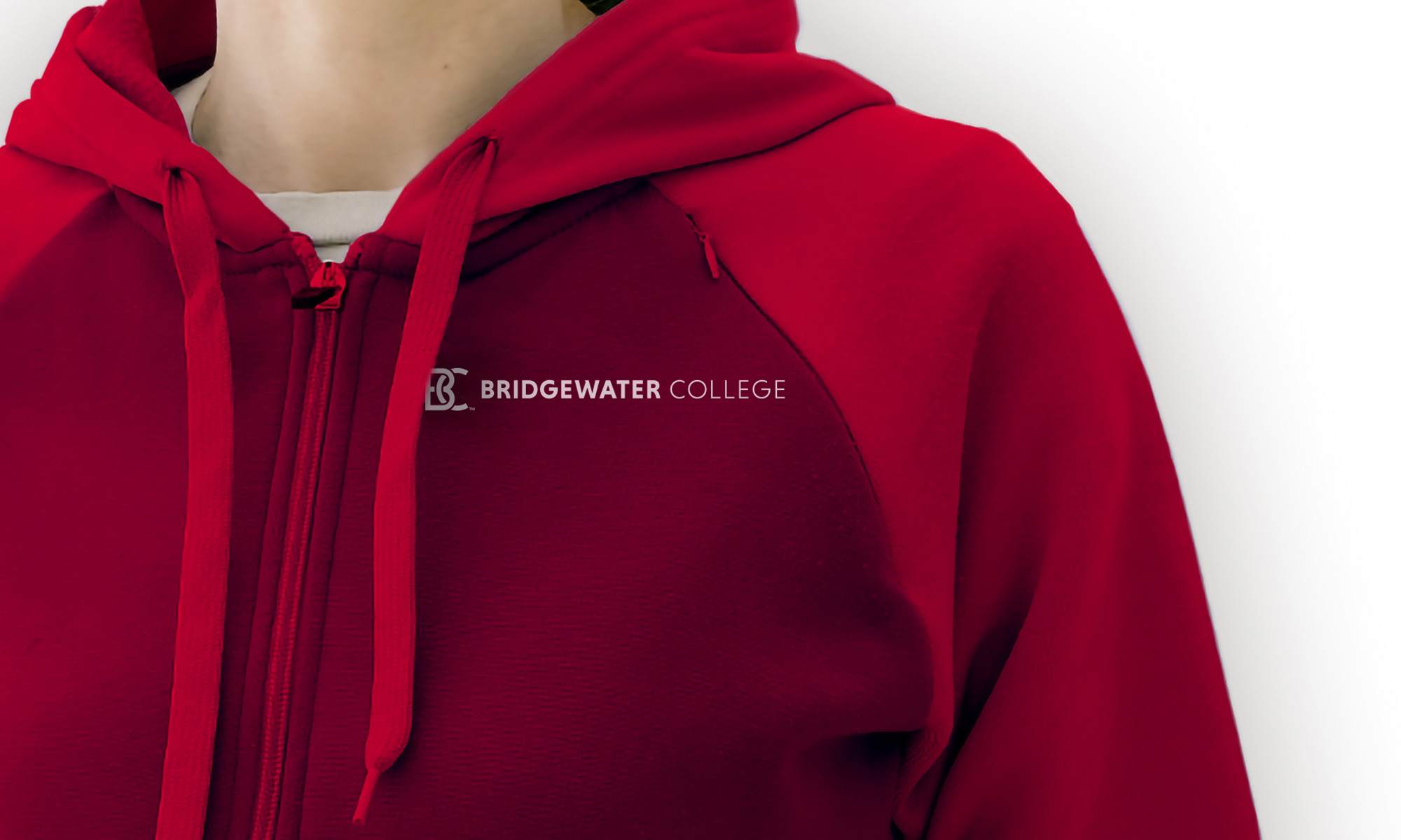 A red hoodie with the new logo.