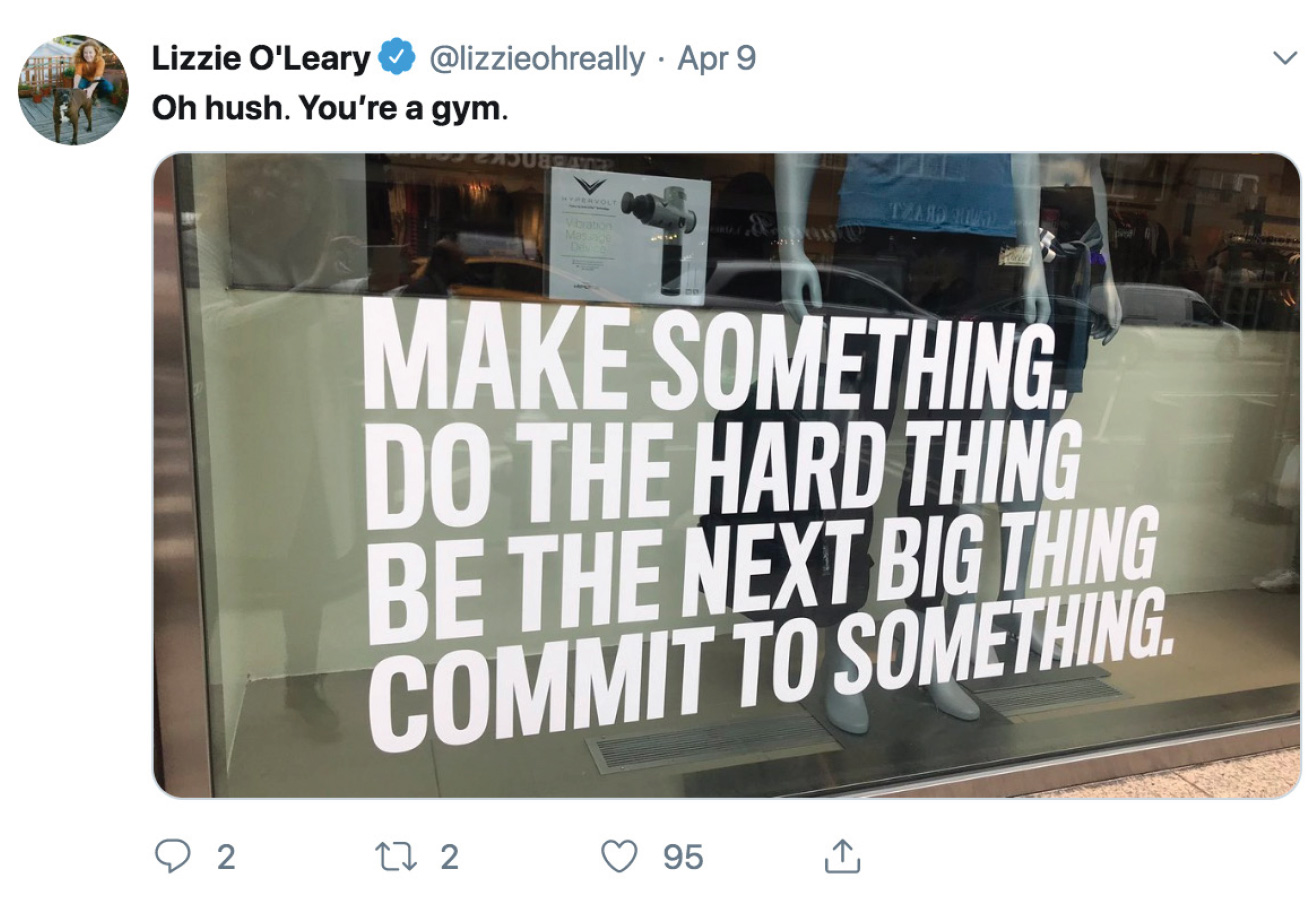 Screenshot of a Tweet showing the window of a business, emblazoned with the text 'Make something. Do the hard thing. Be the next big thing. Commit to something.' The Tweet's comment is, 'Oh hush. You're a gym'.